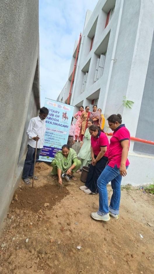 Rotarians planting saplings along the Sonarkui school compound