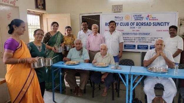 Rotarians serving meals and essential supplies to senior citizens