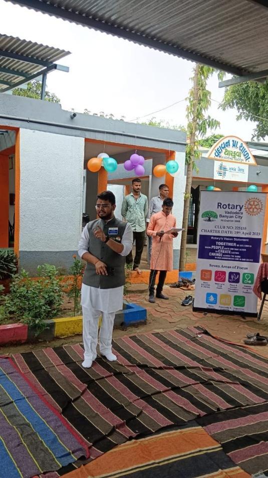 Village children and community members during flag hoisting ceremony