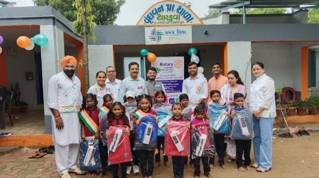 Group photo with students and teachers outside school building